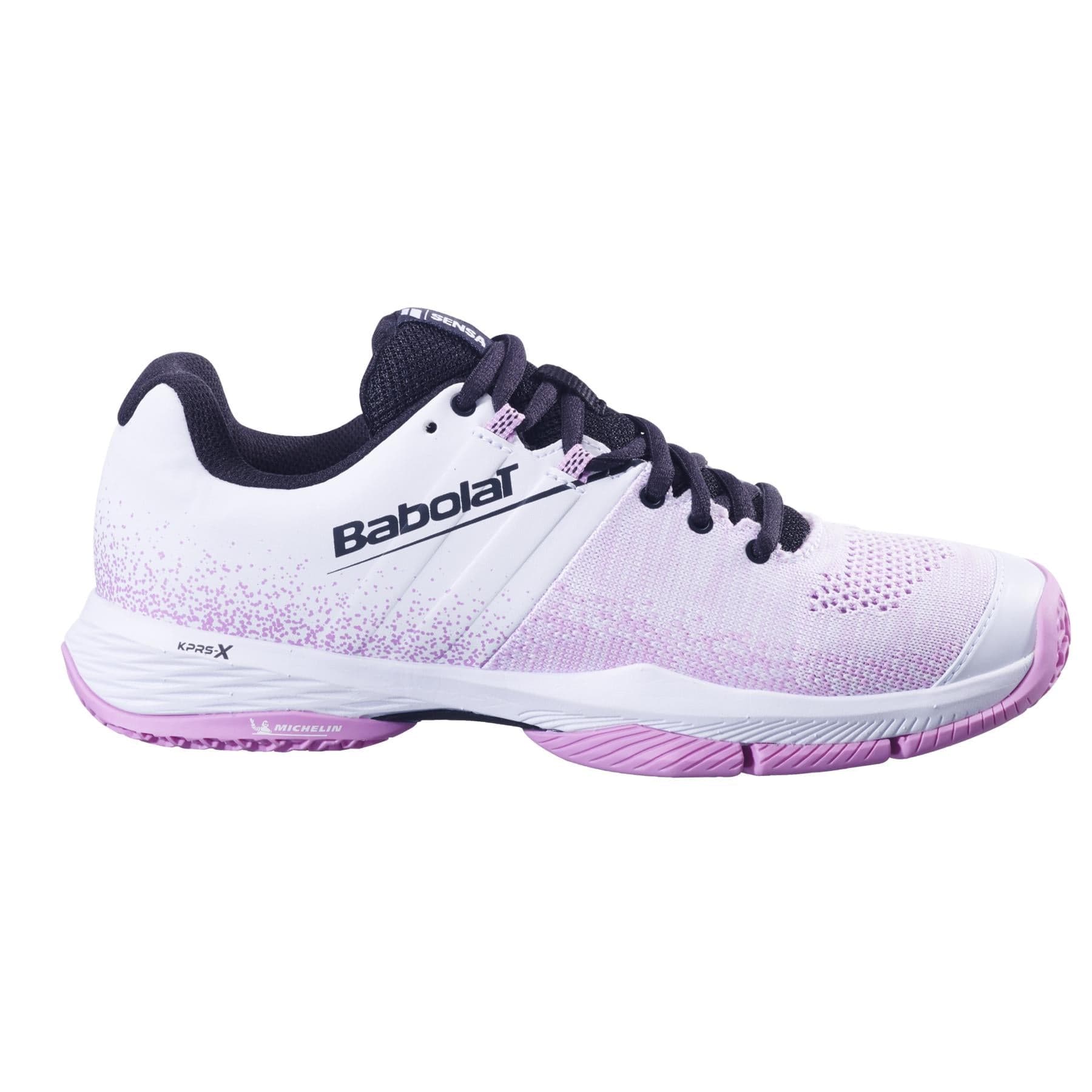 The Babolat Sensa Womens Padel Shoes in White/Lilac feature a gradient design, black laces, black lining, and a purple-white Michelin rubber sole. The "Babolat" logo is displayed on the side.