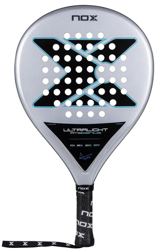 The NOX AT10 Genius Ultralight By Augustin Tapia 2025 padel racket features a silver Fibre Glass Silver finish, large black X design, circular perforations, black handle with NOX wrist strap, and "Ultralight Pro" text on the lower face.