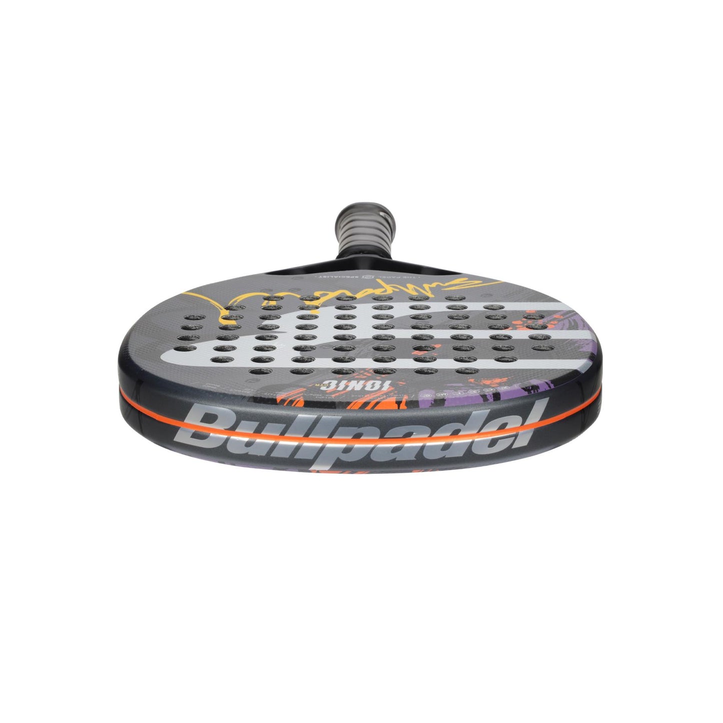 The Bullpadel Ionic Control 2024 Padel Racket in grey features a perforated carbon fiber surface. It has a handle with a textured grip for optimal hold, and the Bullpadel brand name is prominently displayed on the side.