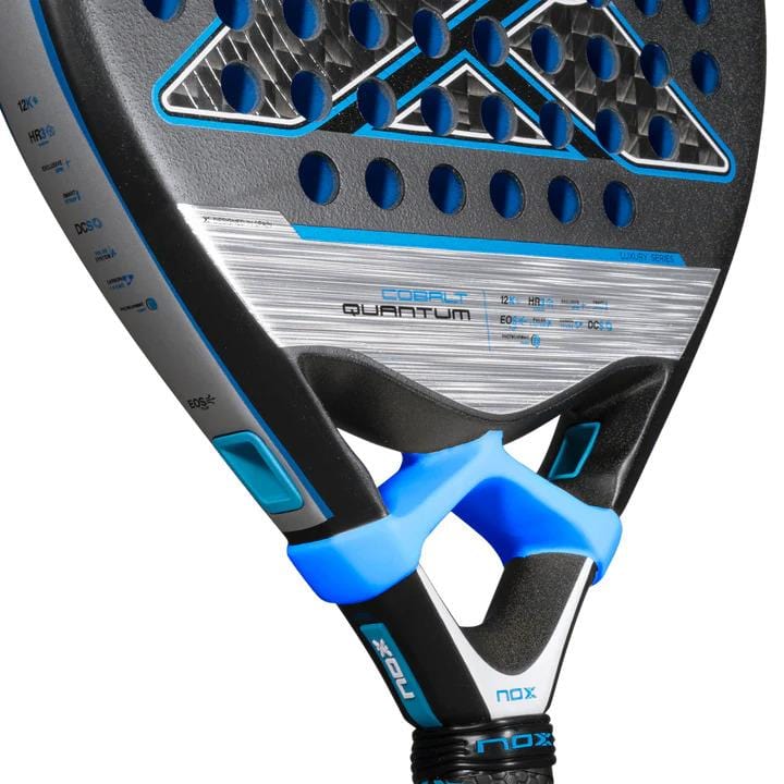 Close-up of the NOX Luxury Quantum 12K Cobalt 2025 Padel Racket in black and blue, showcasing its modern perforated design, "COBAT QUANTUM" branding, and premium 12K carbon fibre construction for top-tier performance.