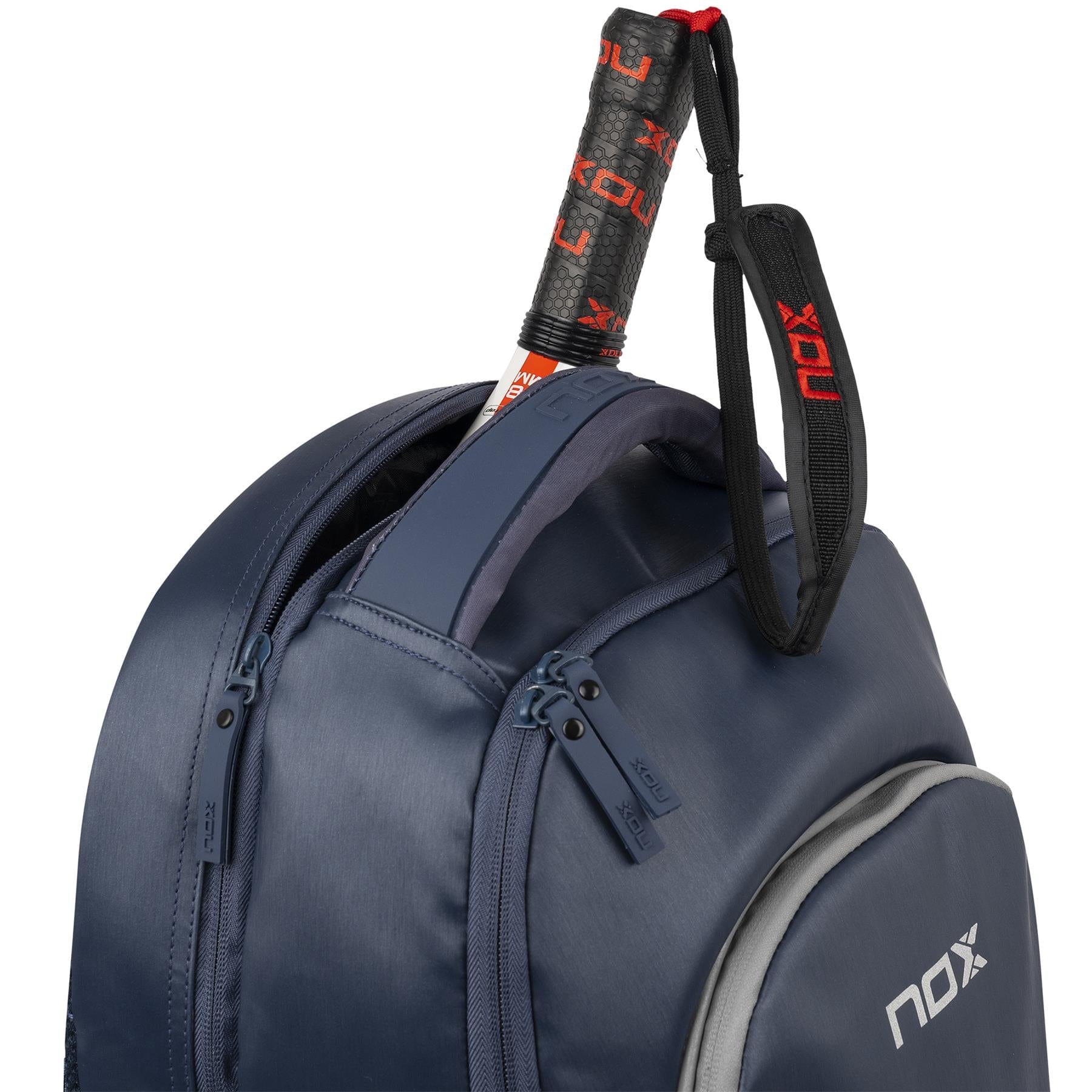 A NOX Pro Series Padel Backpack - Blue holds a padel racket with a black and red NOX grip visible at the top, showing the brand’s distinct design.