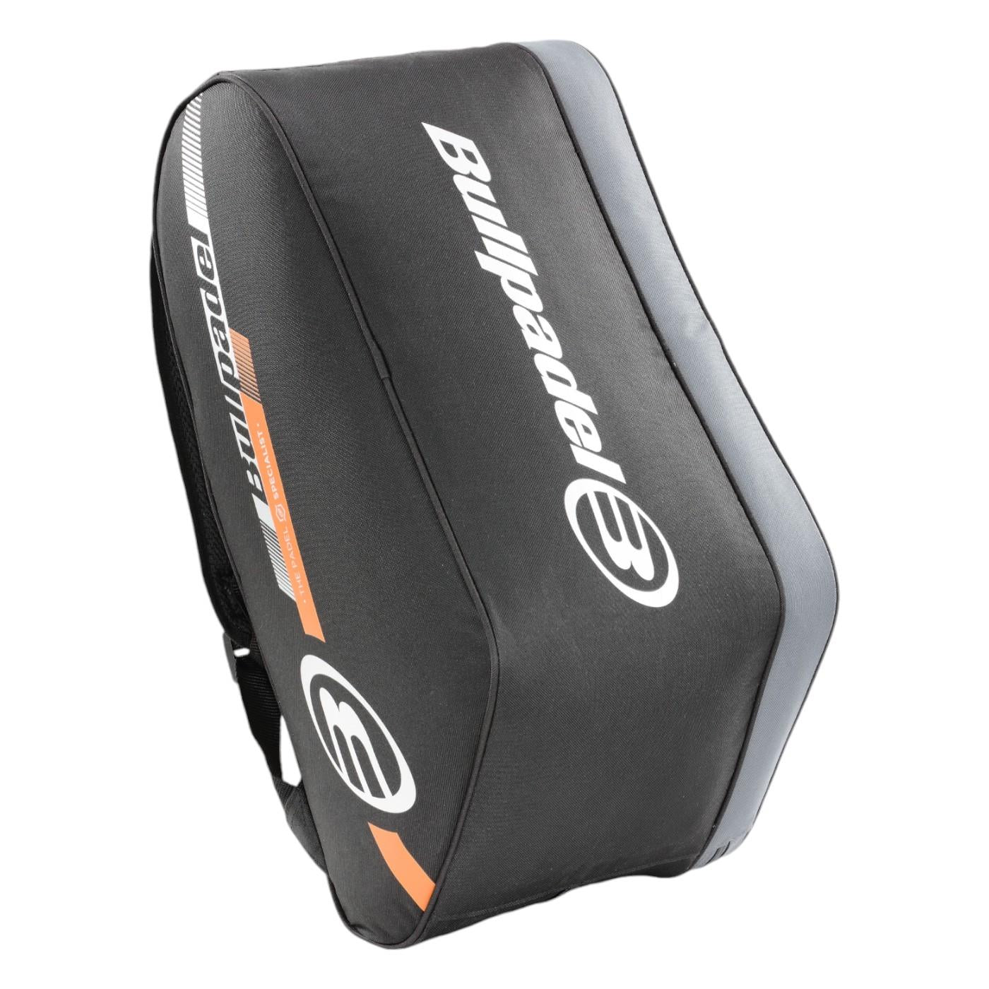 The Bullpadel Tour 25 Padel Racket Bag in black features a sleek design with gray and orange accents, showcasing Bullpadel's name in white. It includes a large front logo, padded racket compartment, and ample storage space for a blend of style and functionality.