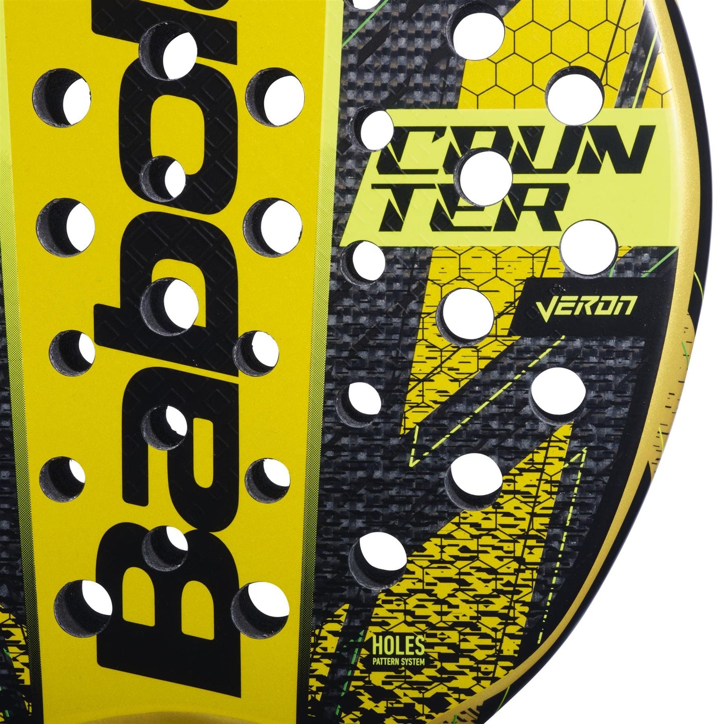Close-up of the Babolat Counter Veron Padel Racket in yellow and black, featuring a honeycomb pattern with multiple circular holes. The text on the surface includes "Babolat," "Counter Veron," and "Veron," all enhanced by Carbon Flex technology for superior play.