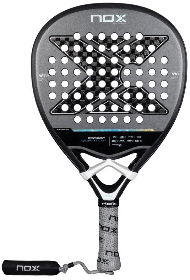 The NOX Luxury Quantum 12K Carbon 2025 Padel Racket in black/grey features a large X design, round holes, and textured grip. Made with 12K carbon fibre and EXCLUSIVE SPIN tech by NOX, it delivers durability and superior control.