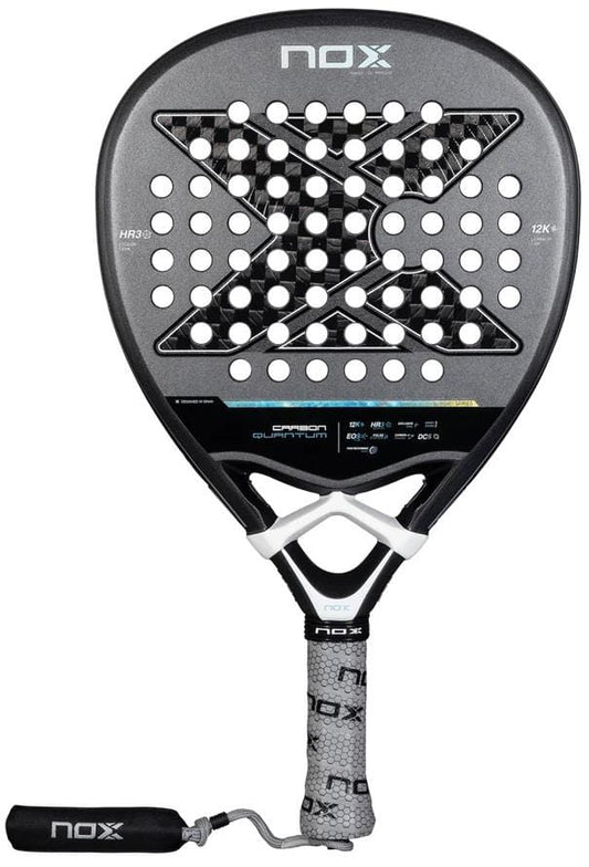 The NOX Luxury Quantum 12K Carbon 2025 Padel Racket in black/grey features a large X design, round holes, and textured grip. Made with 12K carbon fibre and EXCLUSIVE SPIN tech by NOX, it delivers durability and superior control.