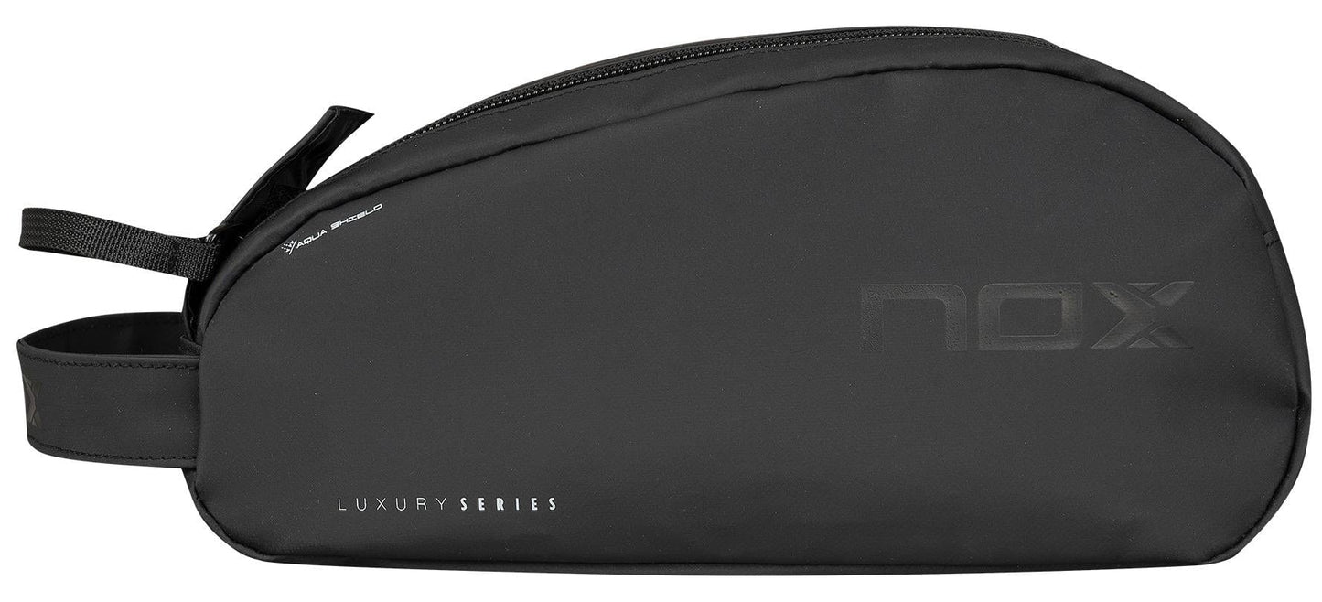 The NOX Luxury Travel Kit Bag - Black / Grey is a minimalist organiser from NOX, featuring a side handle and zip closure. Subtle branding makes it ideal as a toiletry or accessory bag for your essentials.