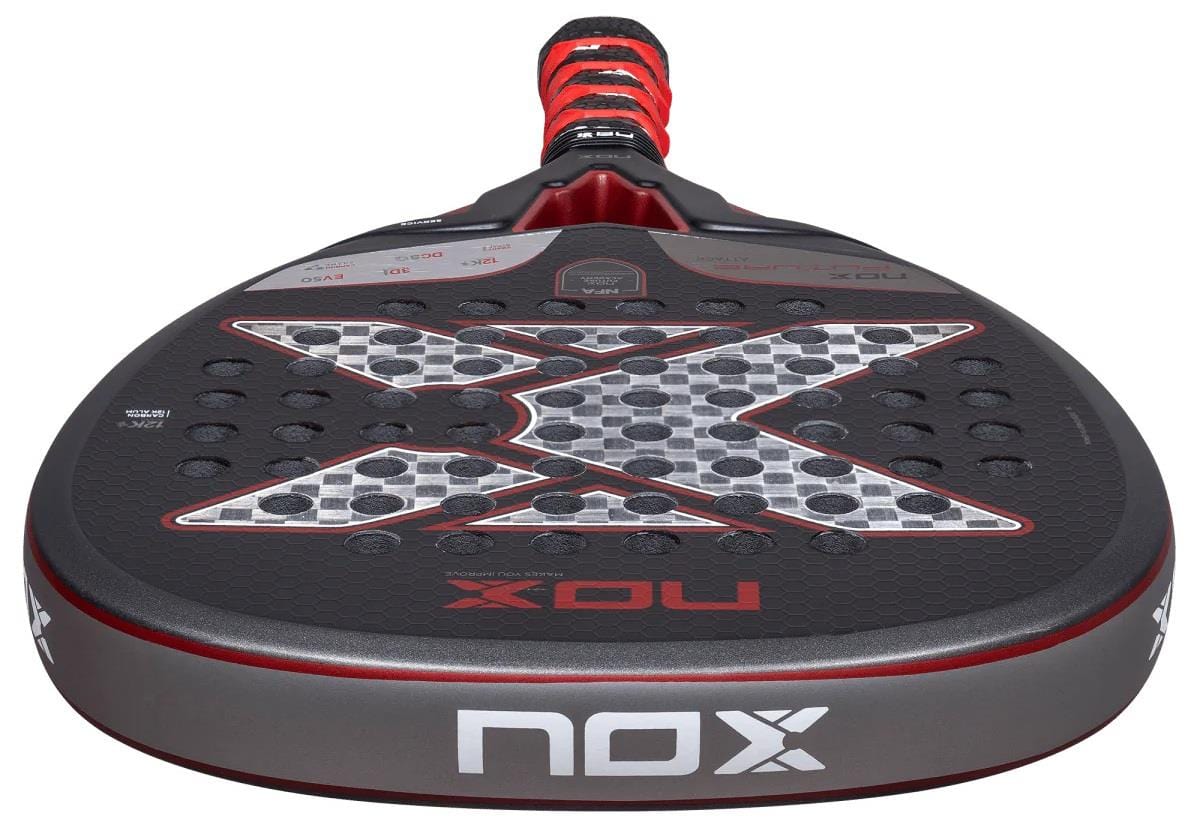 A close-up of the NOX NFA Future Attack 12K Alum Padel Racket by NOX in black and red, with a bold "X" on the face and "NOX" on the edge, made from Carbon Alum 12K for superior performance.
