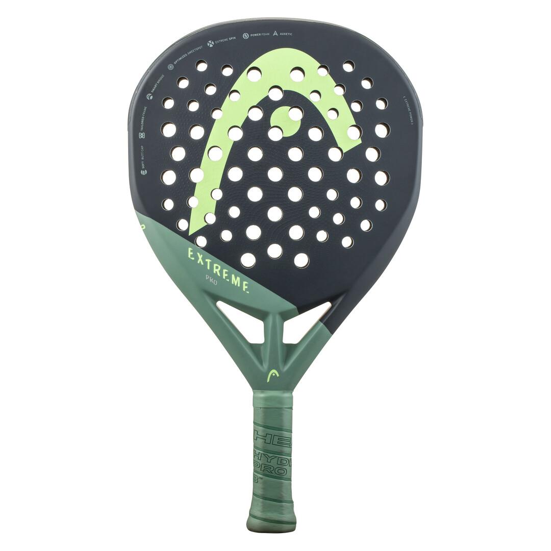 Introducing the HEAD Extreme Pro 2023 Padel Racket - Green, boasting a green and black design with a perforated surface for enhanced control. The iconic large logo adorns the face, while Extreme Spin technology ensures unmatched performance. The "HEAD" brand accentuates the green grip near the handle.
