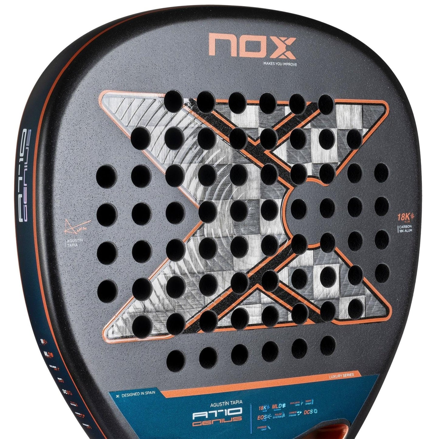 Close-up of the NOX AT10 Luxury Genius Attack 18K Alum By Agustin Tapia 2025 Padel Racket, showcasing a black design with signature X pattern, round holes for aerodynamics, and striking orange and silver details. Brand: NOX.