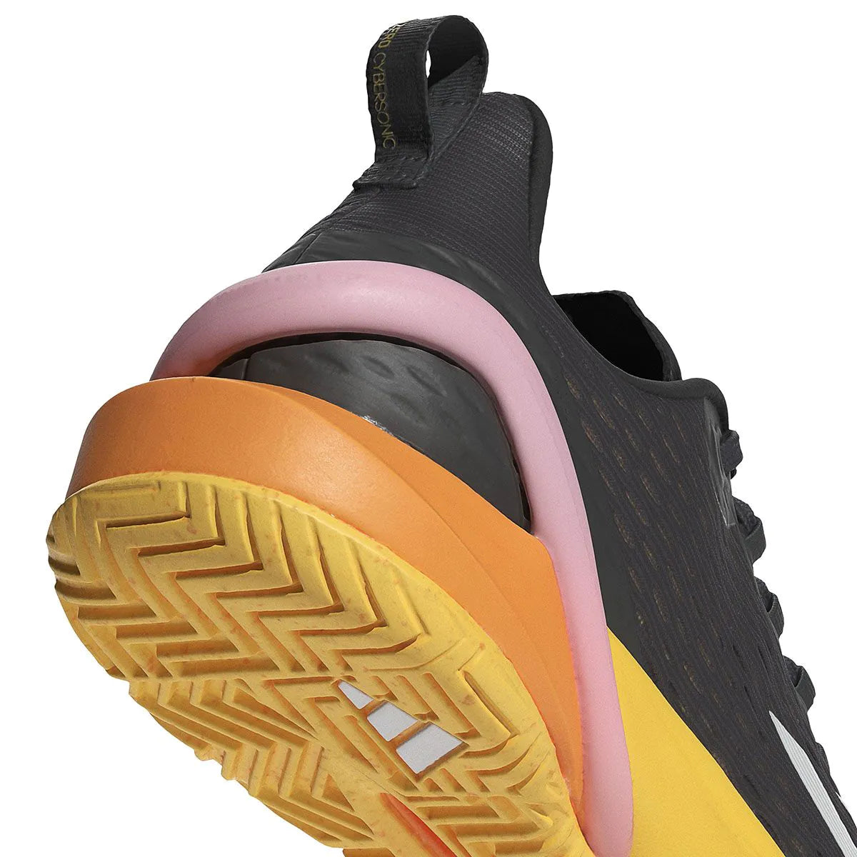 Featuring the ADIDAS Adizero Cybersonic Men's All Court Shoes in Aurora Black, this athletic shoe boasts a textured yellow sole. It showcases vibrant pink and orange accents on the heel, with prominent navy laces against a dark fabric upper. Combining style and performance seamlessly, these shoes are ideal for all court use.
