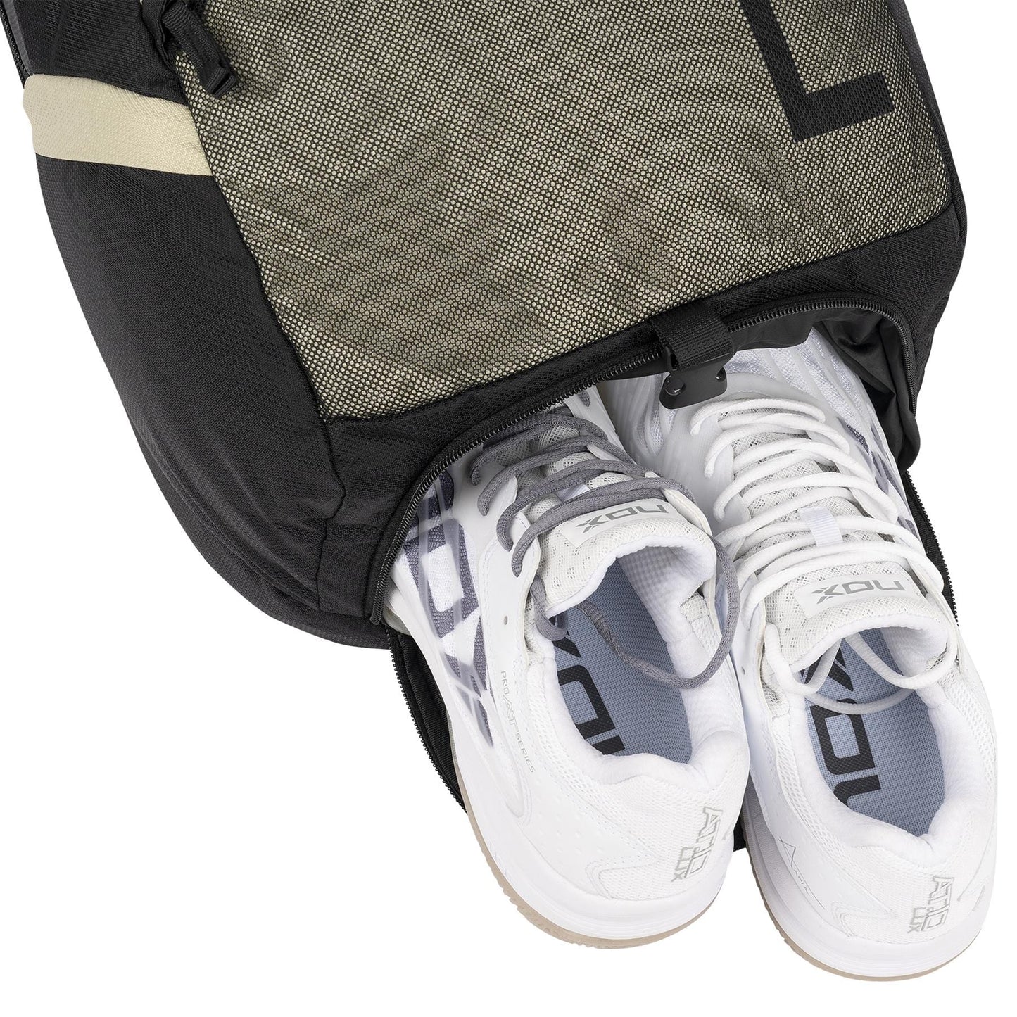 A pair of white athletic shoes peeks out from the open compartment of the NOX Street Series Padel Racket Bag in Black/Grey—by NOX—for an effortless urban look.