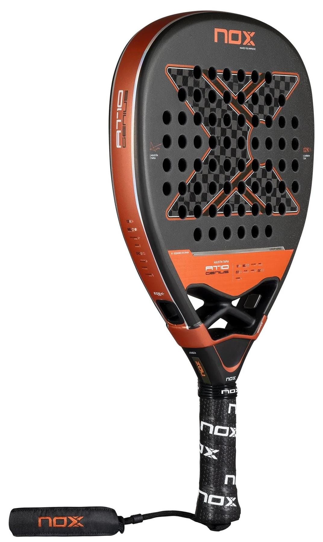 The NOX AT10 Luxury Genius Attack 12K By Agustin Tapia 2025 Padel Racket features a black and orange X-shaped perforated face, 12K carbon fibre construction, and a black handle with NOX grip tape and wrist strap.