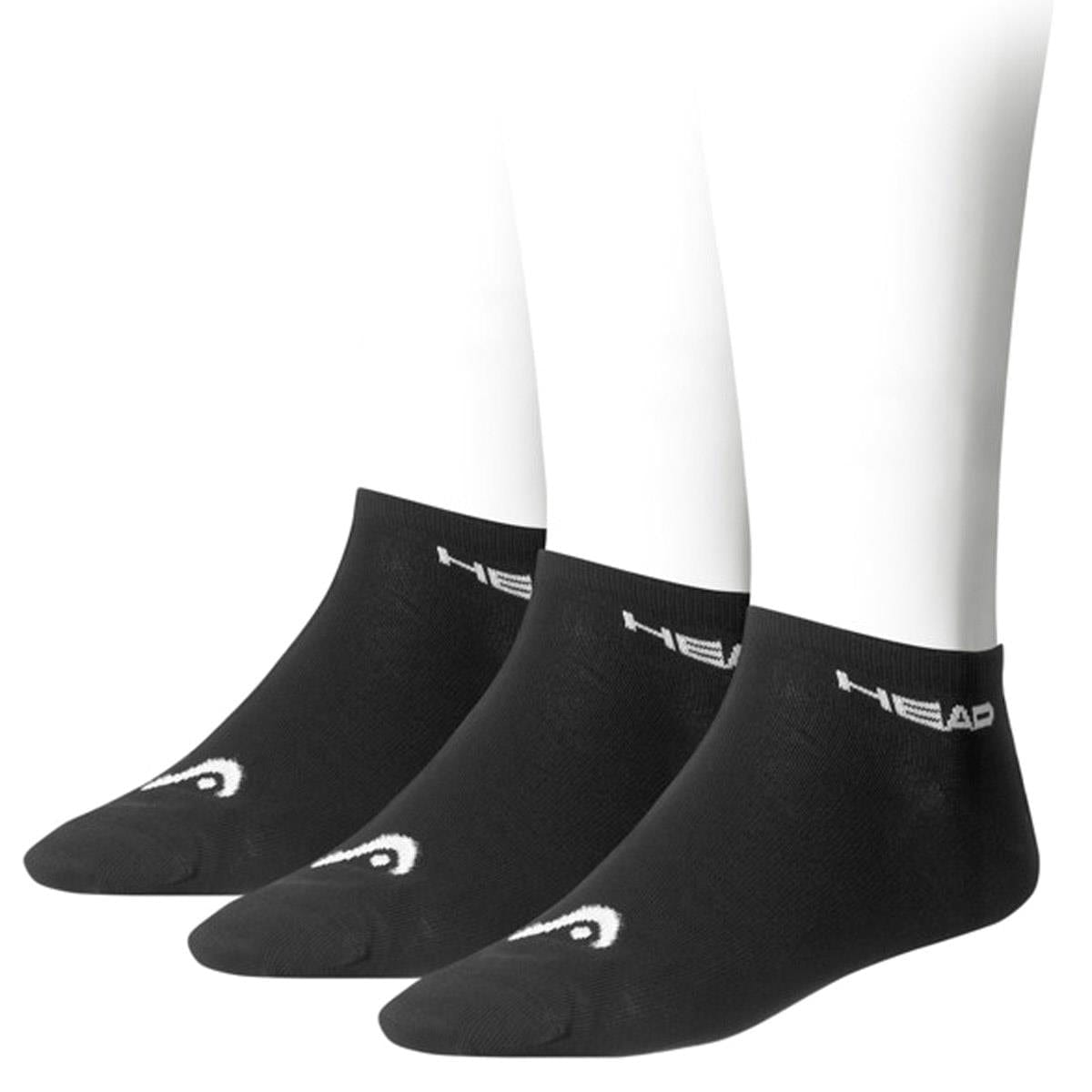Three black HEAD Sneaker Padel Socks (3 Pack) rest stylishly on white mannequin feet, displaying "HEAD" in crisp white near the ankle and a sleek logo on the toe, seamlessly blending comfort and sport-inspired flair. The socks are neatly aligned in a forward-facing row.