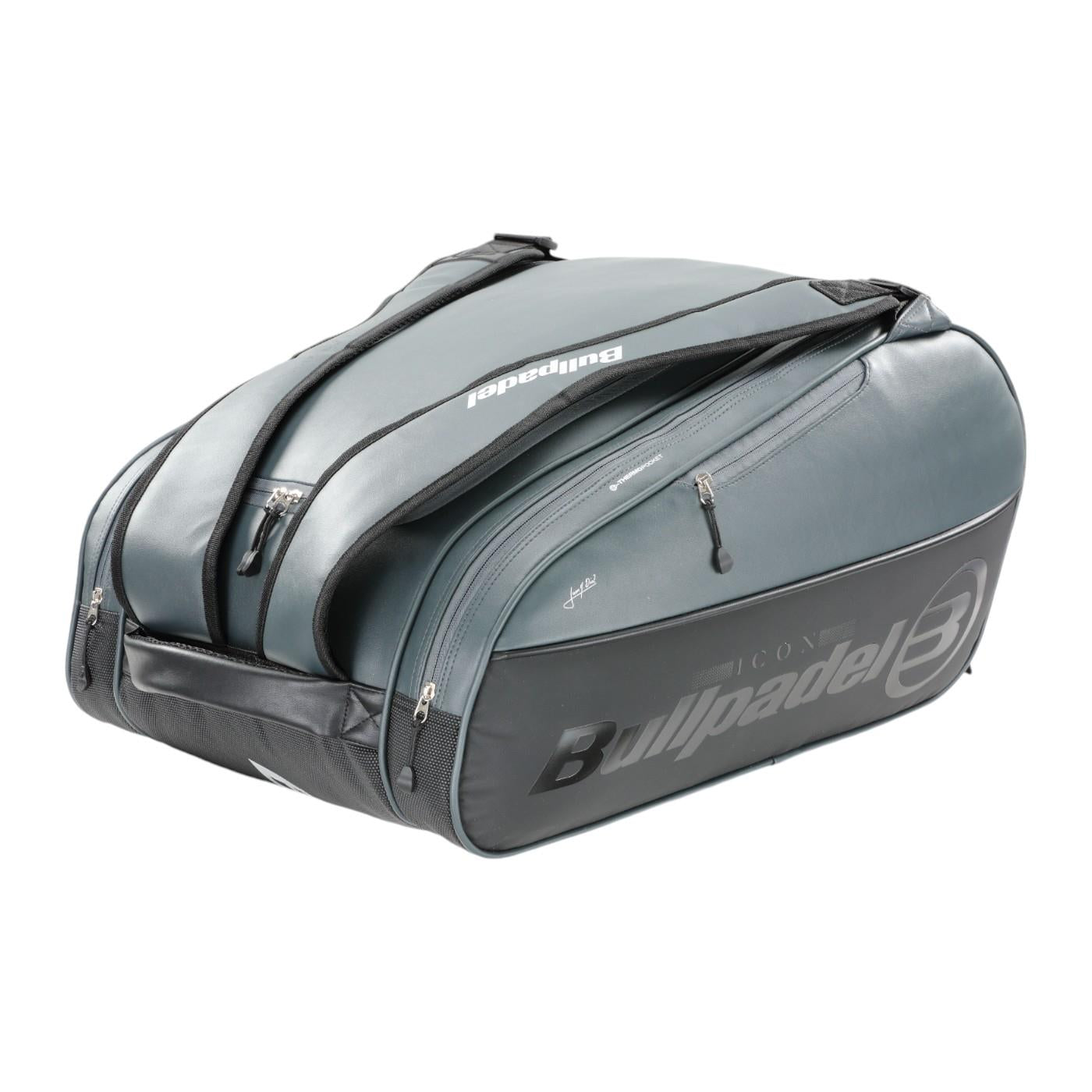 The Bullpadel Icon 25 Padel Racket Bag - Graffiti, preferred by Juan Martín Díaz, features multiple compartments and zippers. It sports the iconic Bullpadel branding and logo, along with a handle and shoulder straps for easy carrying.