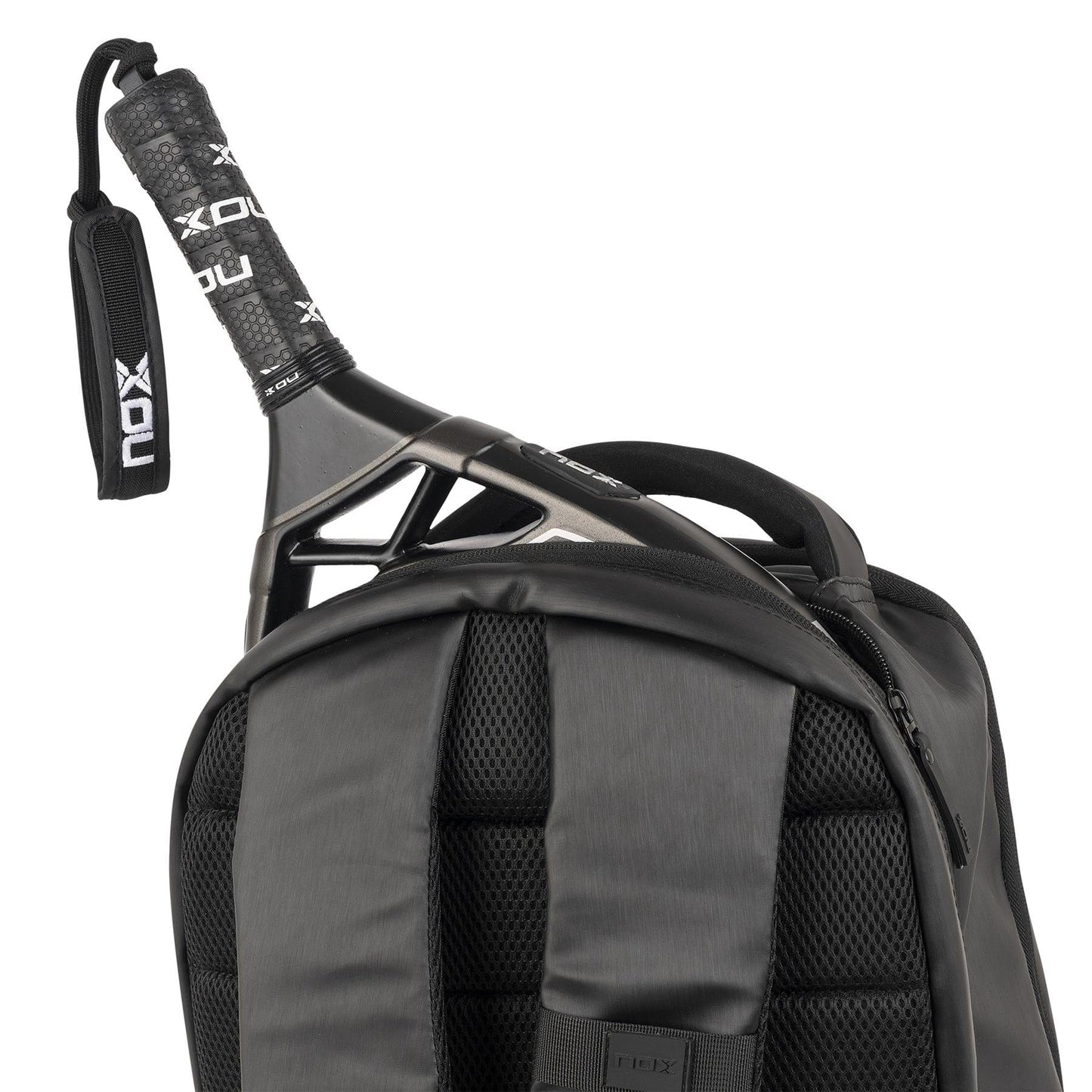A close-up of the NOX Pro Series Padel Backpack - Black, featuring padded straps, mesh backing, and spacious storage, with a black grip padel racket partially inside.