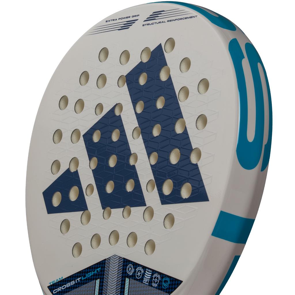 Close-up of the adidas ADIDAS Cross It Team Light 3.4 Padel Racket in white with a blue geometric design, hexagonal pattern, and round holes. Perfect for advanced players seeking aggressive play; features turquoise accents and spec details.