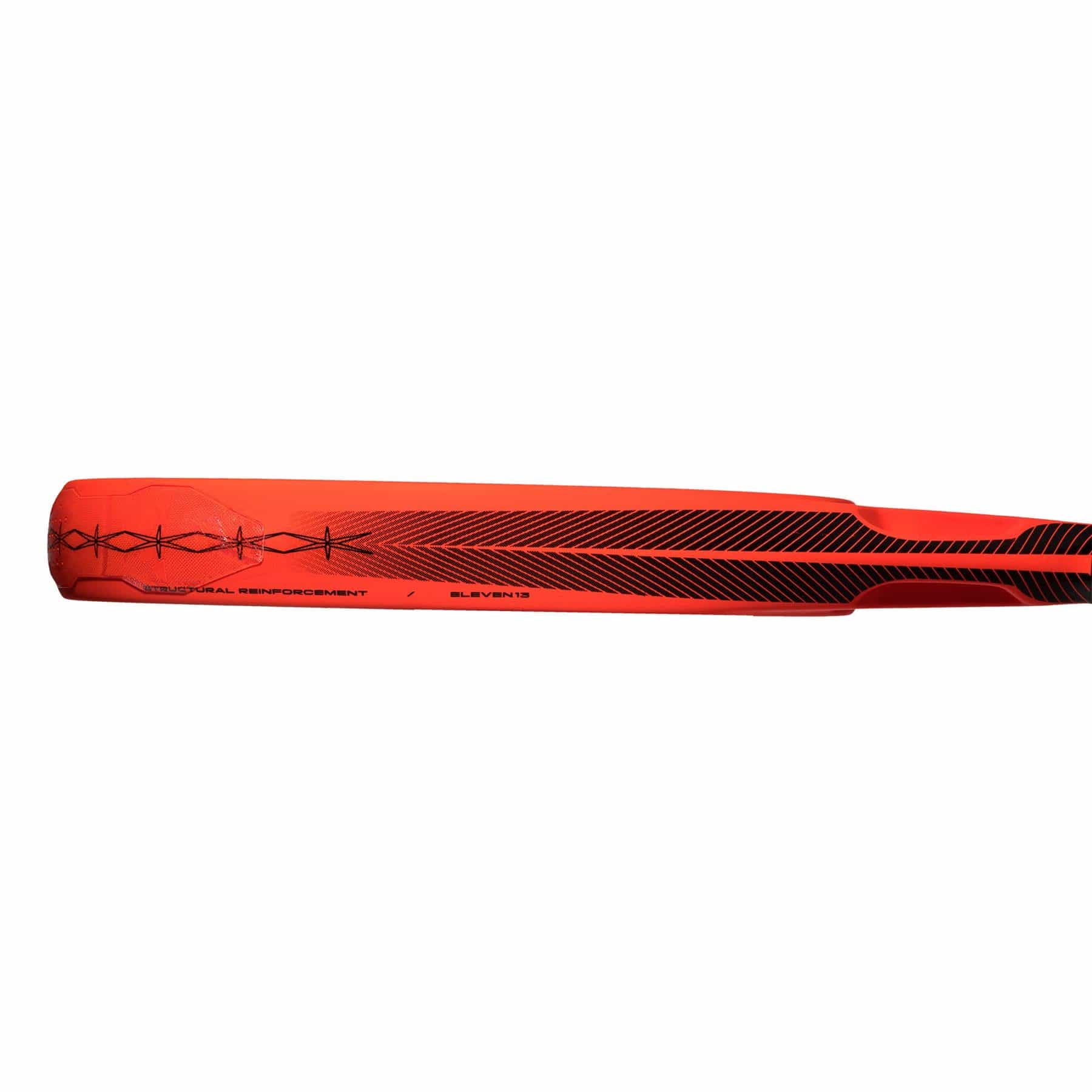 A close-up of an ADIDAS Cross It Padel Racket, featuring a red design with black geometric patterns on the blade, optimized for power and spin. The words "SPATIAL REINFORCEMENT" and "ELEVEN11" are visible near the handle. The image is set against a plain white background.