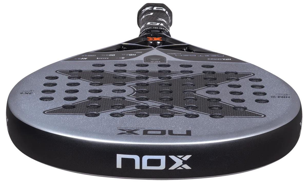 Close-up of the NOX NFA Nextgen Pro Hybrid 3K Padel Racket in silver/black, highlighting its 3K carbon build, perforated face, unique X pattern, and the “NOX” brand name on the side and handle top.