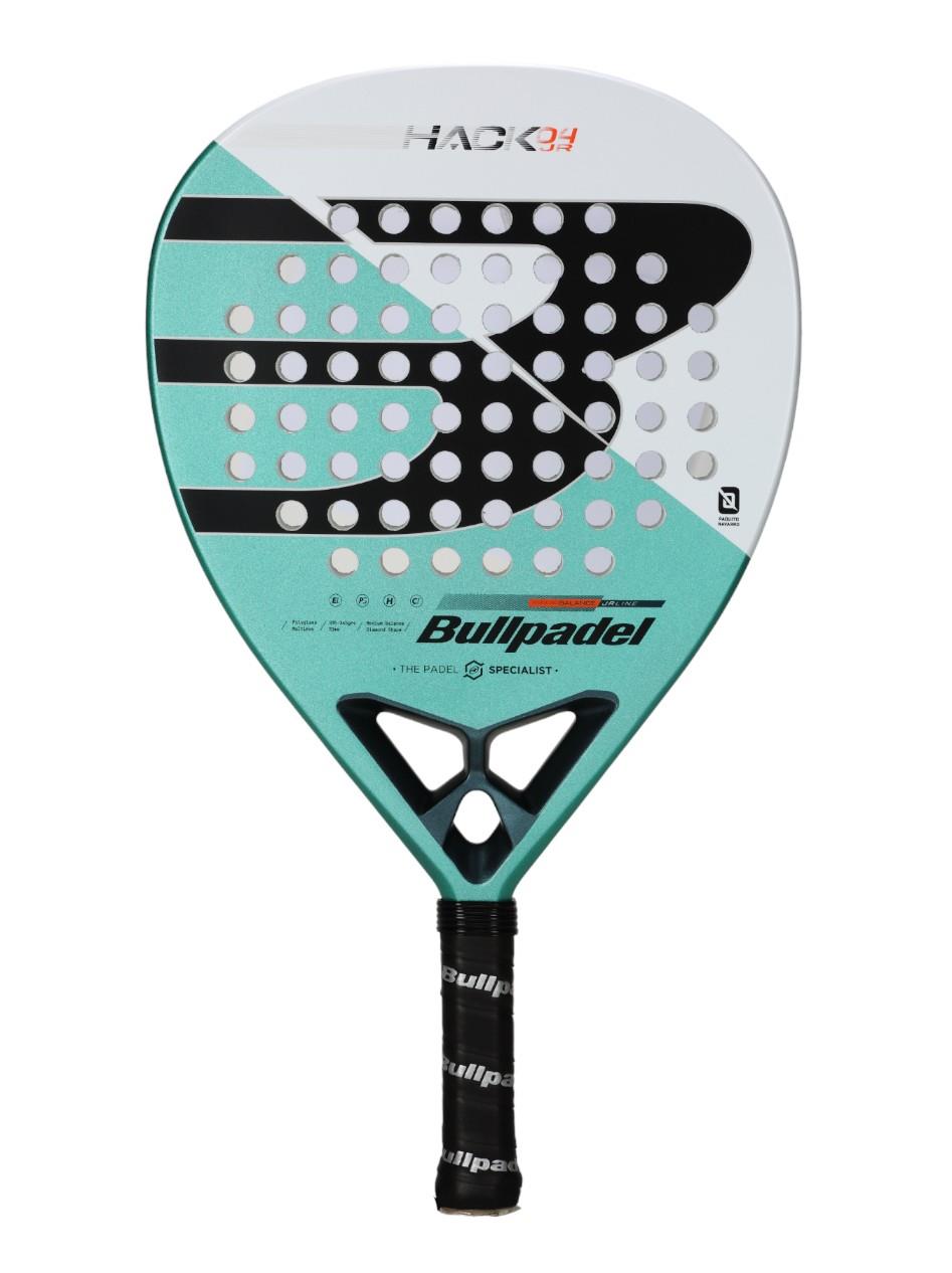 The Bullpadel Hack Junior 25 Padel Racket in teal and white has a teardrop shape, Carbon Tube frame, circular holes, and a black grip with "Bullpadel" branding. It's ideal for advanced junior players.