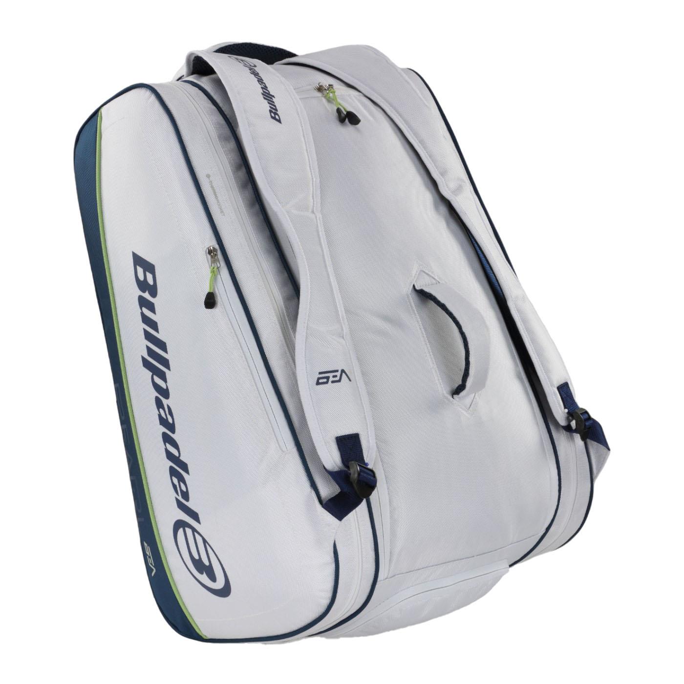 The Bullpadel Pearl 25 Padel Racket Bag in white features "Bullpadel" branding, blue accents, multiple zippered compartments, a handle, and shoulder straps—perfect for fans of Bea González to carry sports gear.