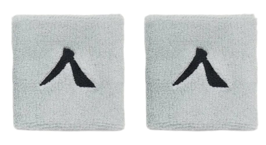 The Kanso 7cm Wristband - 2 Pack in Grey by Kanso offers a stylish, comfortable design with a light gray color featuring an abstract black pattern on white. Made from absorbent fabric, it combines style and practicality for everyday use.