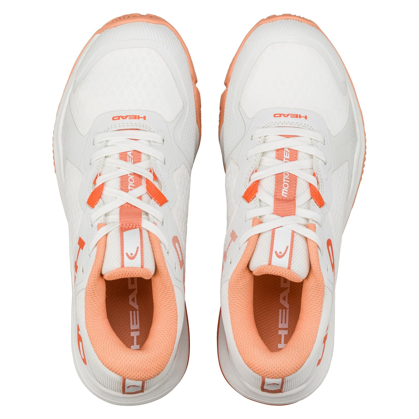 Aerial shot of HEAD Motion Team Women's Padel Shoes in white/coral, showing brand name on the tongue. Designed for stability and comfort, they boast a textured look with coral accents and multi-directional grip soles. Both shoes are displayed side by side.