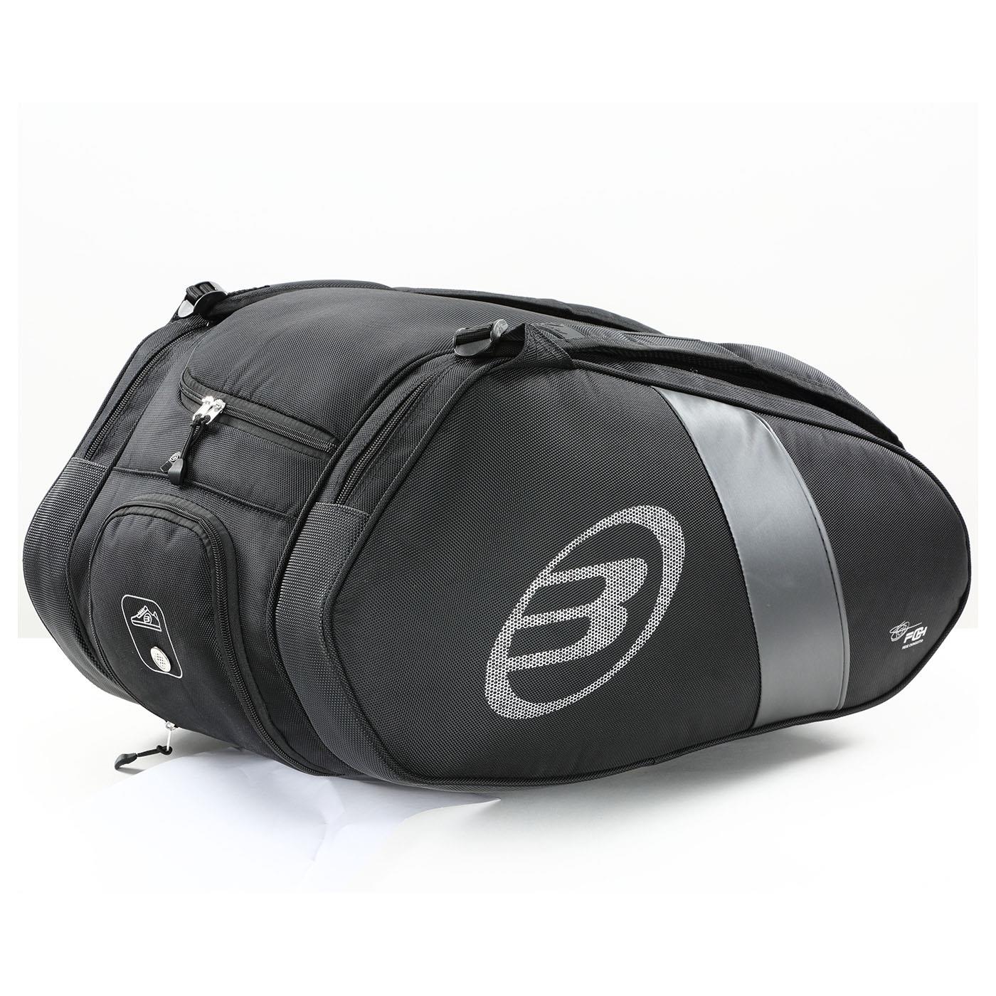 The Bullpadel Neuron 25 Padel Racket Bag is a black motorcycle tail bag with silver accents and a logo on the side, featuring multiple zippered compartments and an aerodynamic design, set against a plain white background.