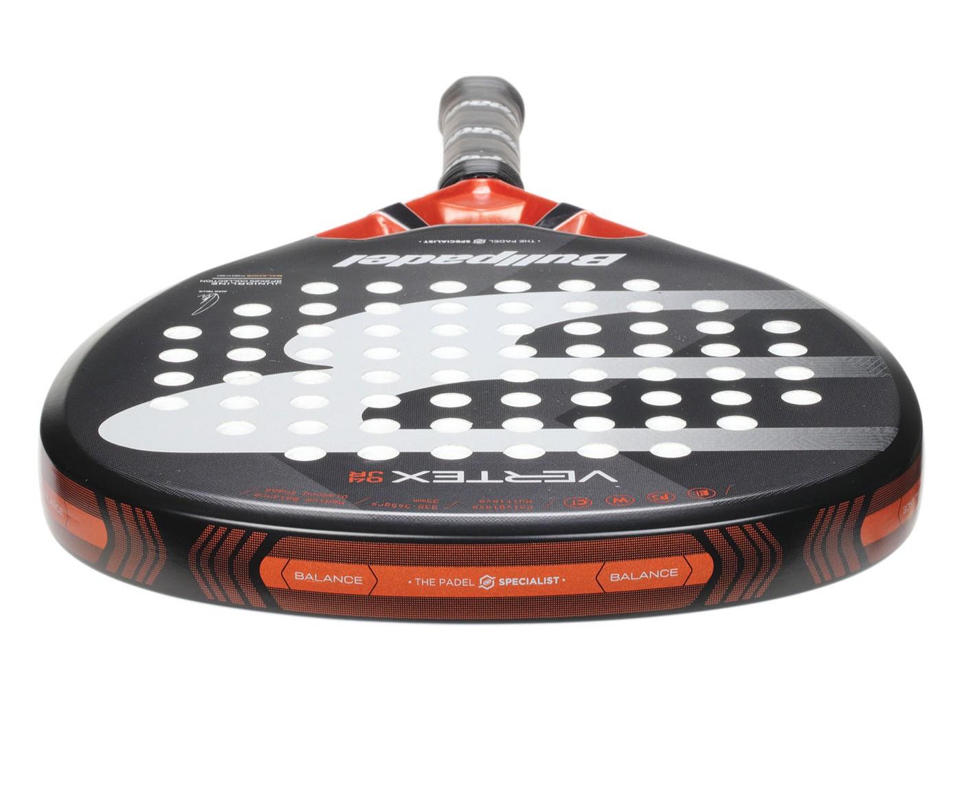 A close-up of the Bullpadel Vertex Junior 25 Padel Racket in black, ideal for young players. It features numerous round holes, "Bullpadel," and "Vertex 3.1" branding, emphasizing balance, with a grey grip-wrapped handle.