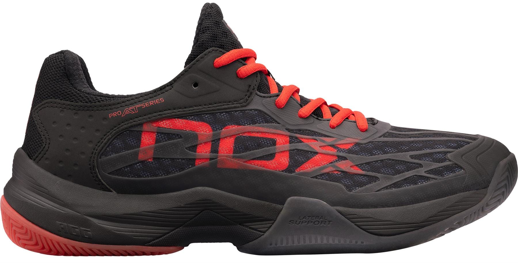 The NOX AT10 Lux Men's Padel Shoes feature a black design with red accents and laces, “NOX” in bold red on the side, a textured sole, and mesh upper—perfect for sports or training and inspired by Agustin Tapia.