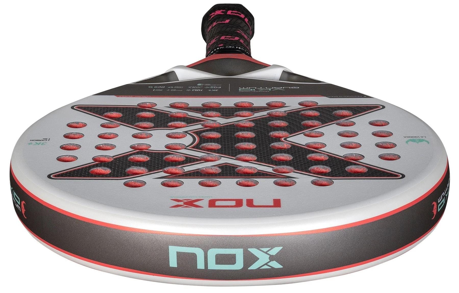 Close-up of the NOX Luxury VK10 Quantum 3K By Aranzazu Osoro 2025 Padel Racket, showing a round face with red holes, bold "X" design, TECH E0S Flap, signature branding, and black/red grip by NOX.