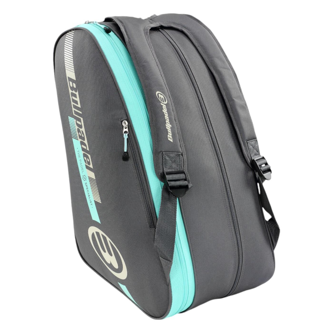 The Bullpadel Tour 25 Padel Racket Bag in grey boasts the "BMW Padel" text and logo, has multiple zippered compartments, adjustable shoulder straps, and a padded racket compartment, making it perfect for enthusiasts.