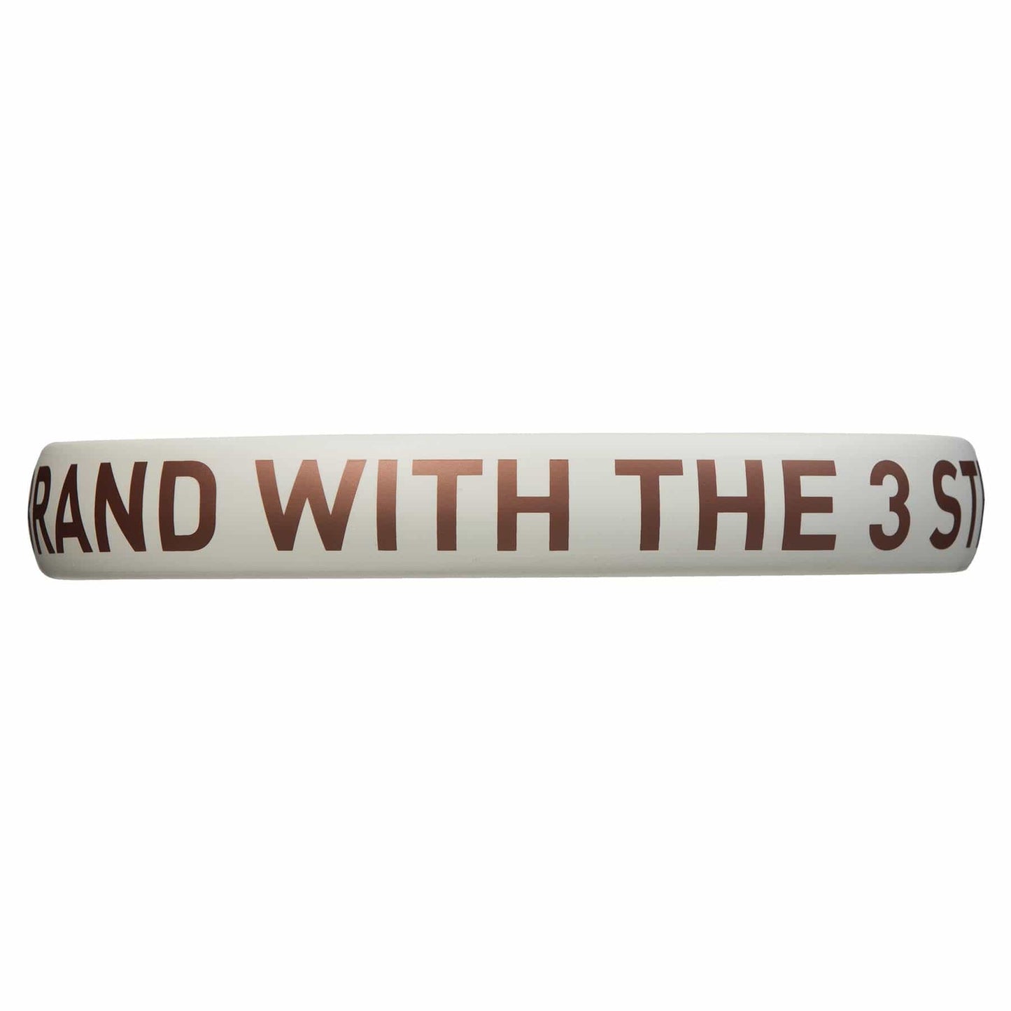 A white circular object, possibly a ring or band, displays brown text that partially reads "RAND WITH THE 3 ST." It resembles the balance and precision found in an ADIDAS Drive 3.3 Padel Racket - Vintage by adidas, renowned for its control and comfort—ideal for beginners seeking to refine their skills.