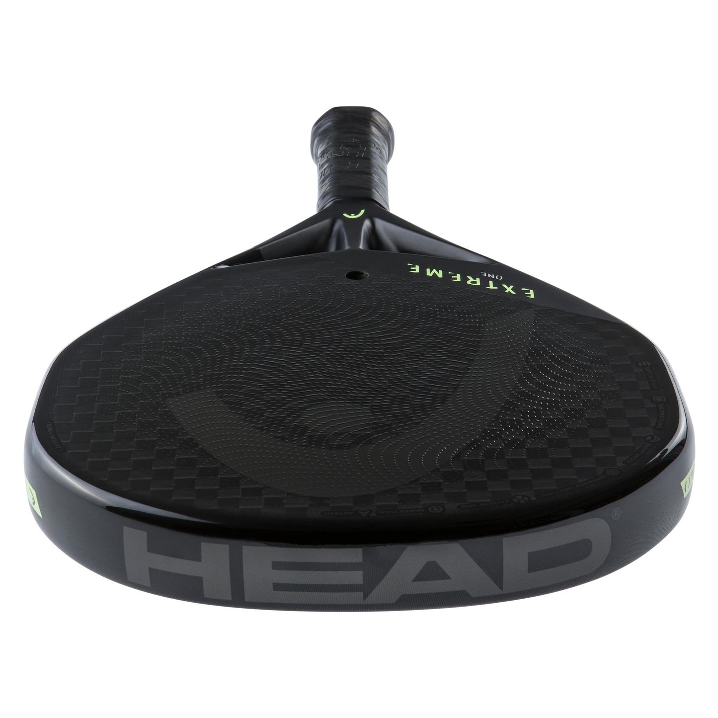 Detailed view of a black paddle that highlights a sleek 12K carbon fiber surface. The "HEAD" logo is prominently displayed at the bottom, while "EXTREME" commands attention near the top. Its streamlined design and textured grip are reminiscent of the precision offered by the HEAD Extreme One 2023 Padel Racket - Black, featuring Auxetic technology for enhanced performance.