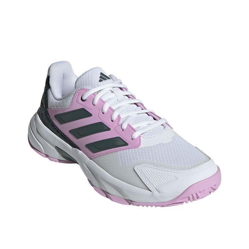 The ADIDAS CourtJam Control 3 Women's All Court Shoes, available in Bronze Strata with Legend Ink and Bliss Lilac accents, feature a textured sole, lace-up design, and Bounce midsole for enhanced comfort. Crafted using recycled materials, this shoe offers both sustainability and style.