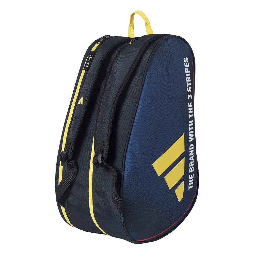 The adidas Control 3.4 Padel Racket Bag - Blue features black and navy blue colors with yellow accents, two zippered compartments with yellow pulls, and "THE BRAND WITH THE 3 STRIPES" and adidas logo in white on the side—ideal for rackets.