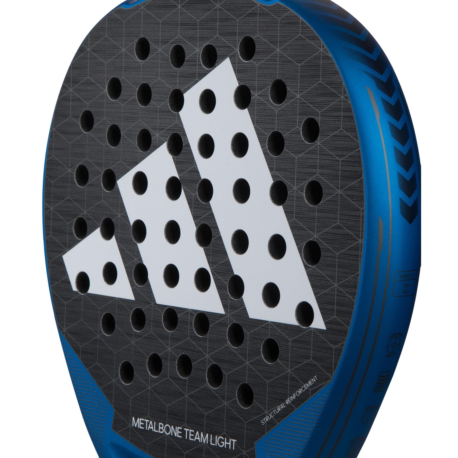 An up-close view of the adidas Metalbone Team Light 3.3 Padel Racket—black with a prominent white geometric logo and numerous round holes. It features a blue edge adorned with intricate patterns, utilizing Spin Blade Grit for exceptional performance. The text displays "METALBONE TEAM LIGHT," highlighting Soft Performance EVA, ensuring optimal comfort and control.