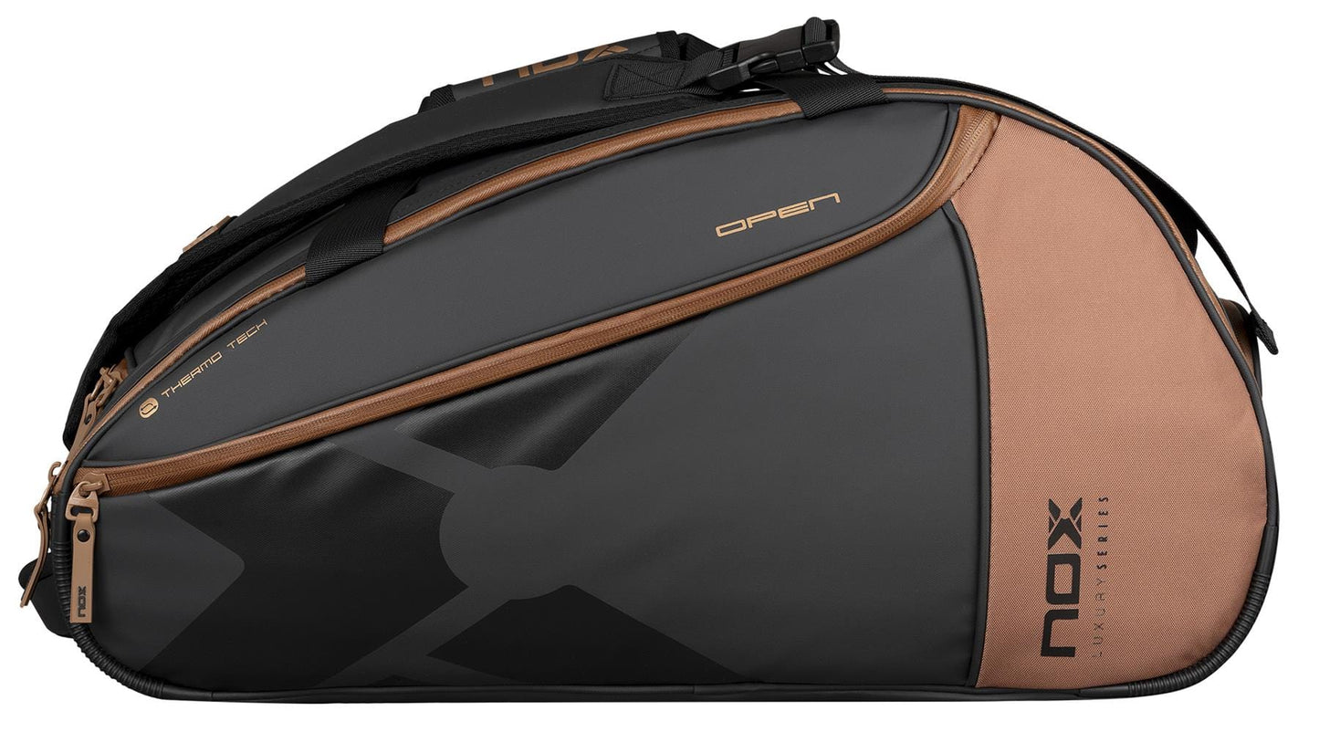 The NOX Luxury Open Series Padel Racket Bag in black and brown features multiple compartments, advanced ThermoTech technology, and "NOX Luxury Series" branding—perfect for stylish padel players.