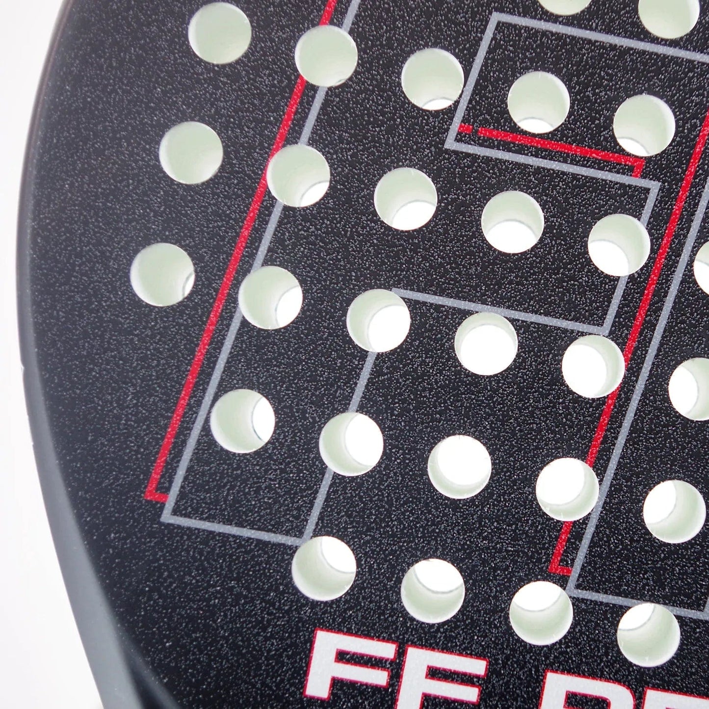 Close-up of a Karakal FF Pro 375 Padel Racket in black, featuring circular holes and red geometric lines. The textured surface is perfect for spin shots, with the partial text "FE DE" in red located at the bottom.
