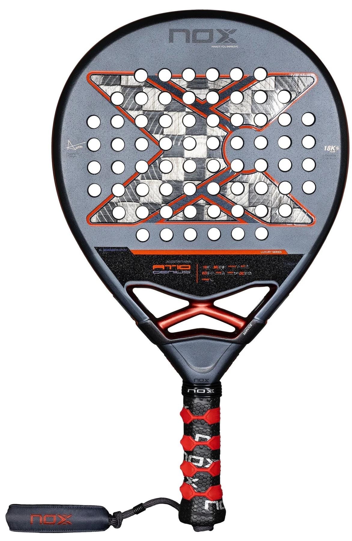 The NOX AT10 Luxury Genius 18K Alum By Agustin Tapia 2025 padel racket features a black and red design with a large X, multiple perforations, matching grip tape, and a black wrist strap with the NOX logo.