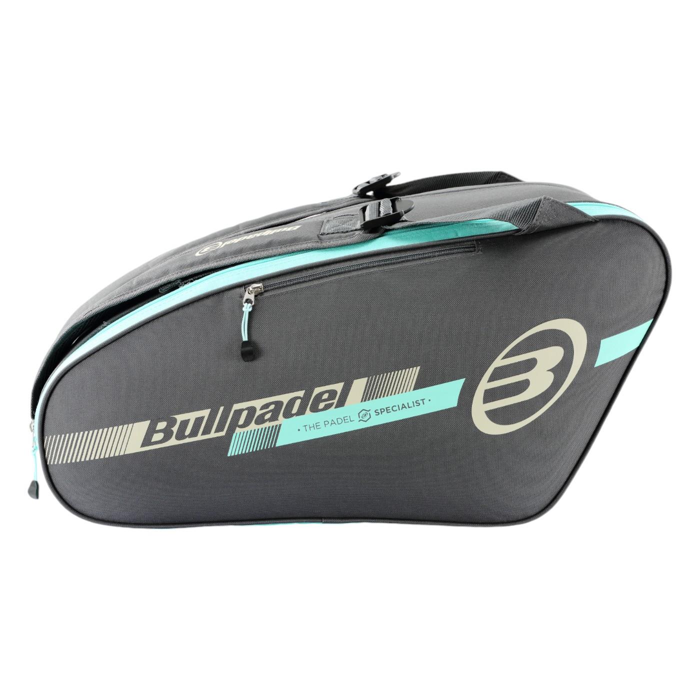 The Bullpadel Tour 25 Padel Racket Bag in grey features a zippered main section and a padded racket compartment. It prominently displays the logo with "THE PADEL SPECIALIST," making it ideal for padel enthusiasts.