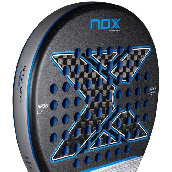 Close-up of the NOX Luxury Quantum 12K Cobalt 2025 padel racket in black/blue, showing its bold X design, blue details, circular holes, and visible "COBALT QUANTUM" and "HR3" logos on the durable 12K carbon fibre surface.