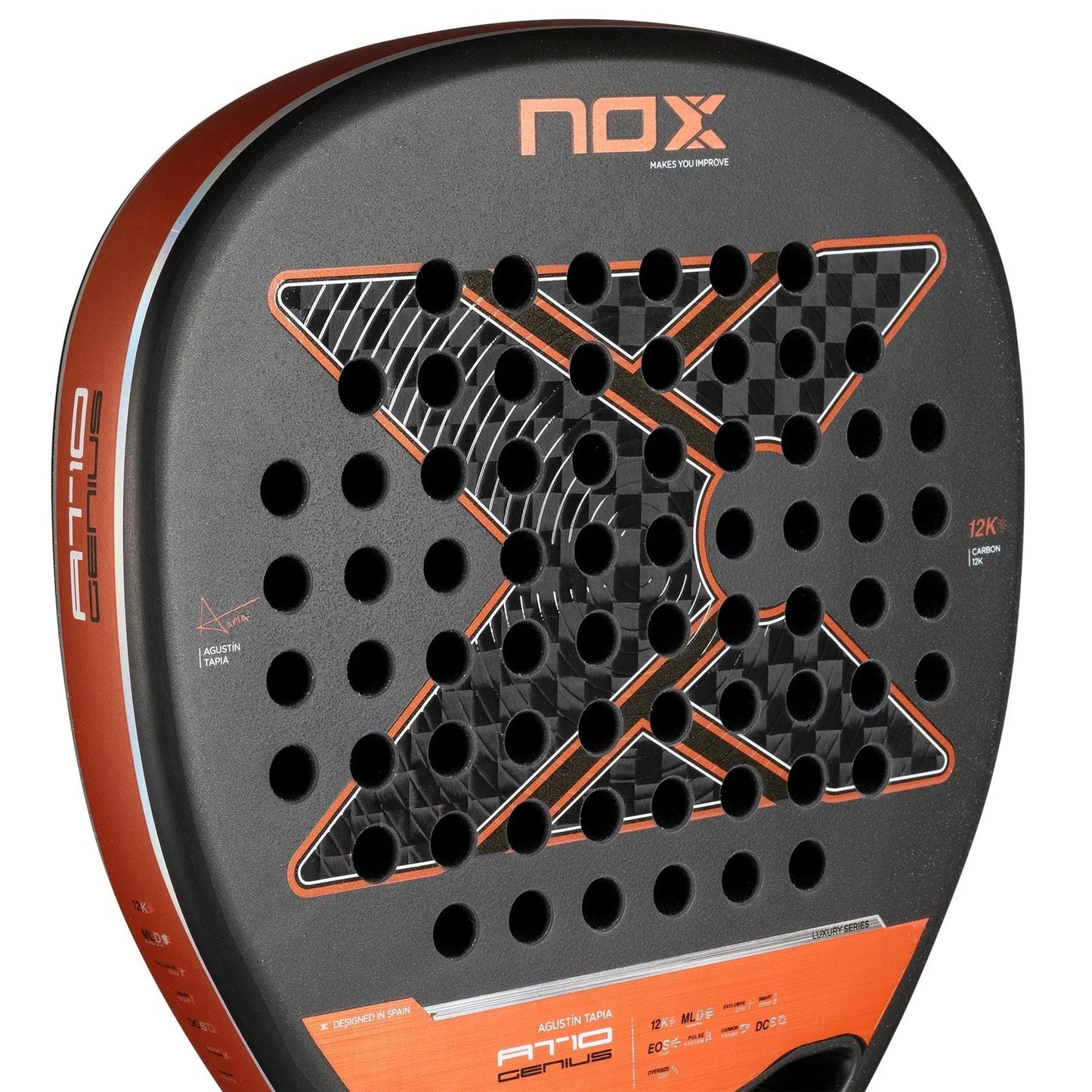Close-up of the NOX AT10 Luxury Genius Attack 12K By Agustin Tapia 2025 Padel Racket, showcasing its bold black "X," red edges, and signature branding elements that reflect Agustin Tapia’s unique style.