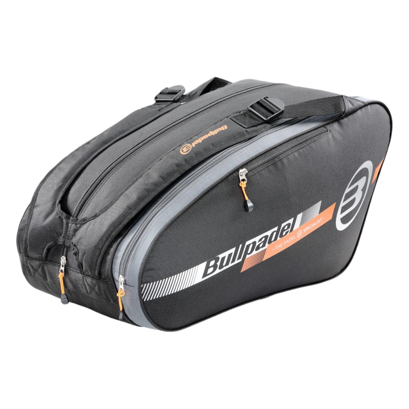 The Bullpadel Tour 25 Padel Racket Bag - Black by Bullpadel features bold orange zipper pulls. It offers ample space with multiple compartments, including a padded section for secure storage of your equipment and accessories.