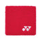 Introducing the Yonex AC493 Padel Wristband in red, from the renowned brand Yonex. This square wrist sweatband features a distinctive white logo with two circles and a triangular shape located in the lower right corner. Crafted from soft, textured fabric, it promises to keep you cool and dry during your workouts.