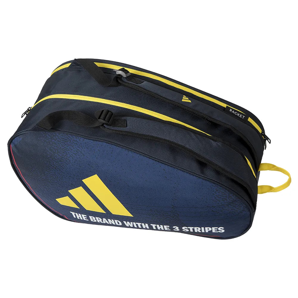 The adidas Control 3.4 Padel Racket Bag – Blue features black and yellow accents, zippers, and bold branding with "THE BRAND WITH THE 3 STRIPES," offering a stylish way to carry your court gear.