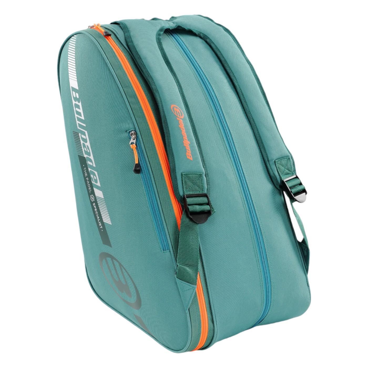 The Bullpadel Tour 25 Padel Racket Bag - Teal by Bullpadel features two main compartments, including a padded racket compartment, adjustable shoulder straps, a printed logo on the side, and a streamlined lightweight design perfect for carrying sports equipment.