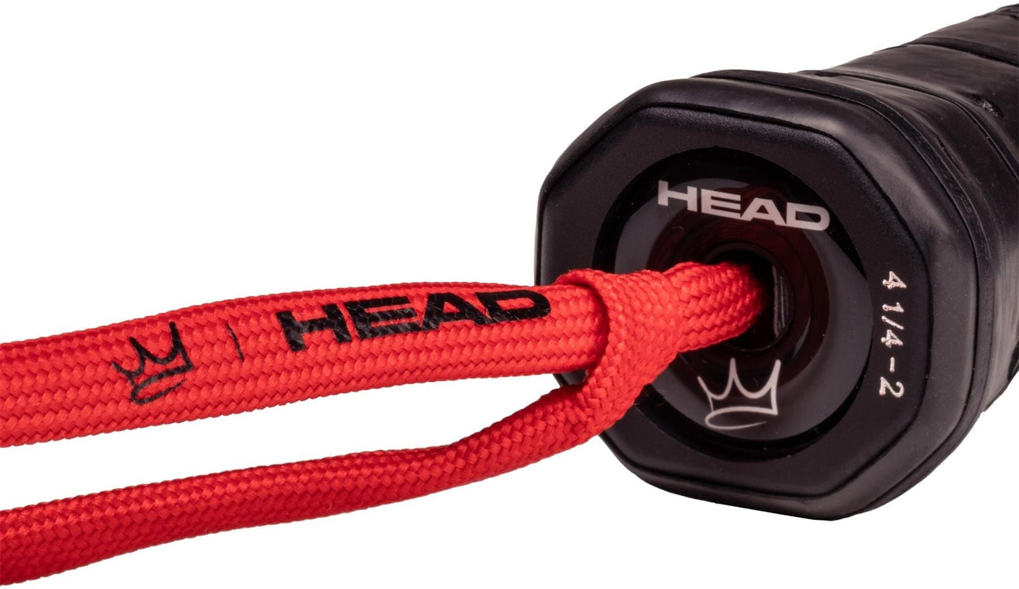 Close-up of the HEAD Coello Team 2025 Padel Racket - Black handle, featuring bold HEAD branding, a red wrist strap, white "414-2" markings, and enhanced with Auxetic 2.0 technology.