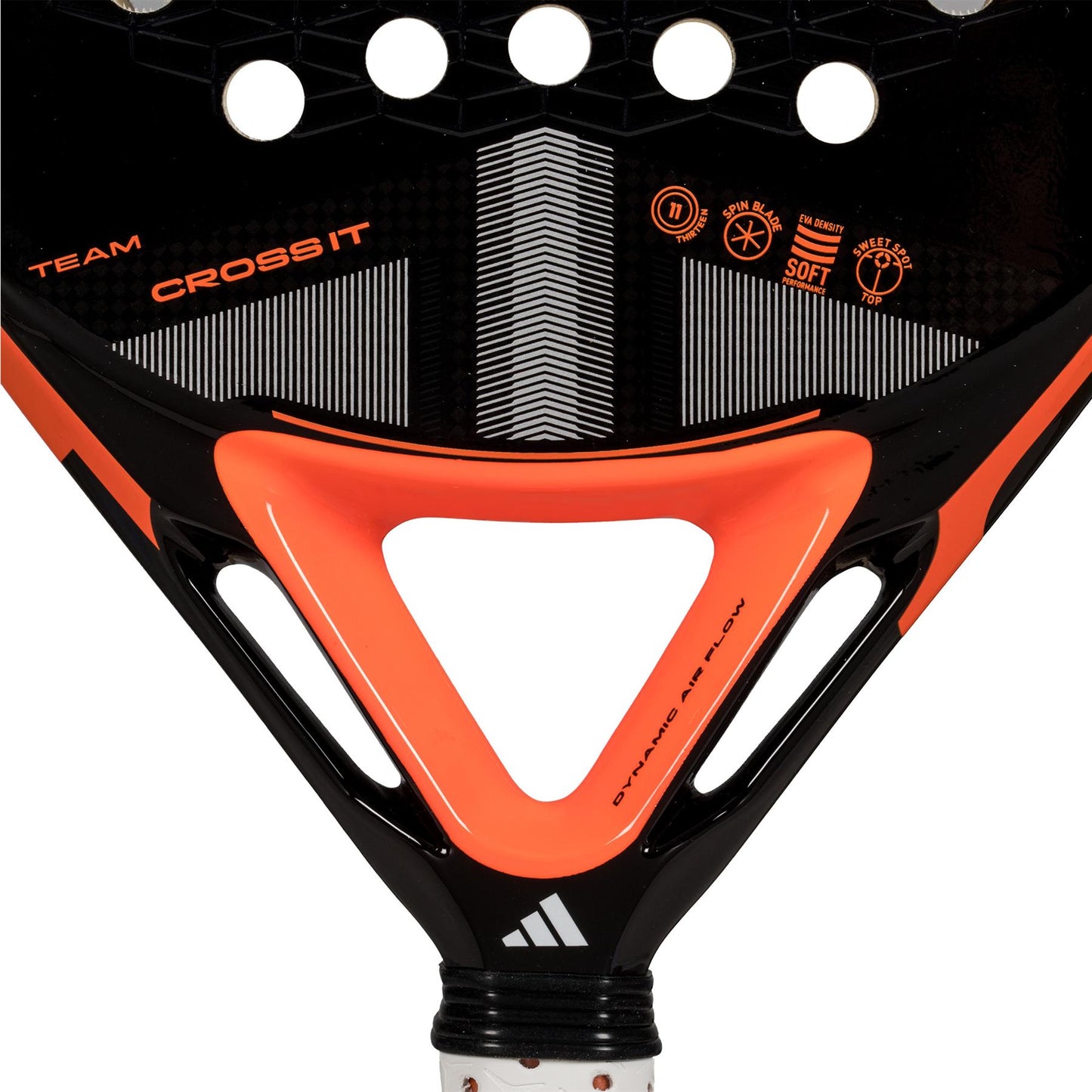 Close-up of the ADIDAS Cross It Team 3.4 padel racket head in black and orange, featuring the adidas brand name and logos. The design has circular cutouts for airflow, a triangular pattern with "TEAM CROSS IT," perfect for advanced players.