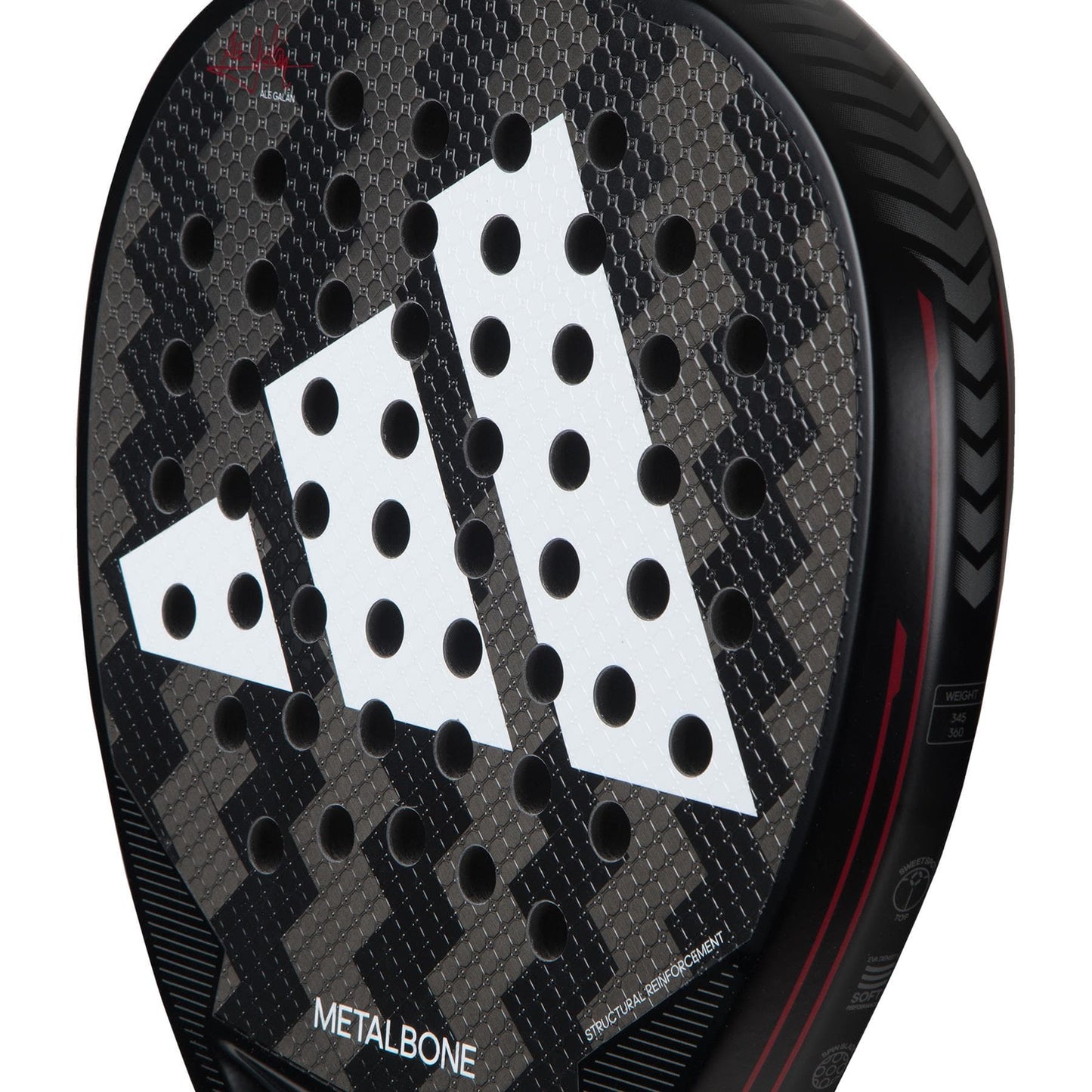 Close-up of the ADIDAS Metalbone 3.3 Padel Racket in Black/Red, showcasing a unique geometric pattern and a striking white adidas logo. Crafted for advanced players, it features a textured surface for increased power and prominently displays the "METALBONE" branding.
