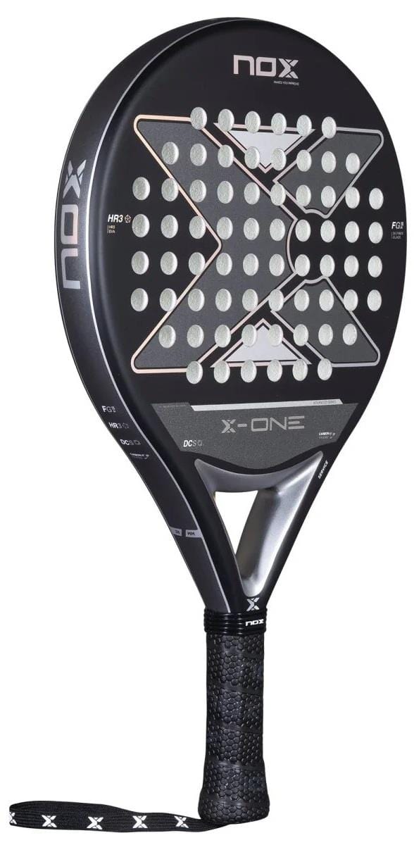 The NOX X-One Advance Series Padel Racket in black features silver and white detailing, a perforated surface, HR3 rubber core, large central X design, and a black grip with NOX branding on the neck and handle.